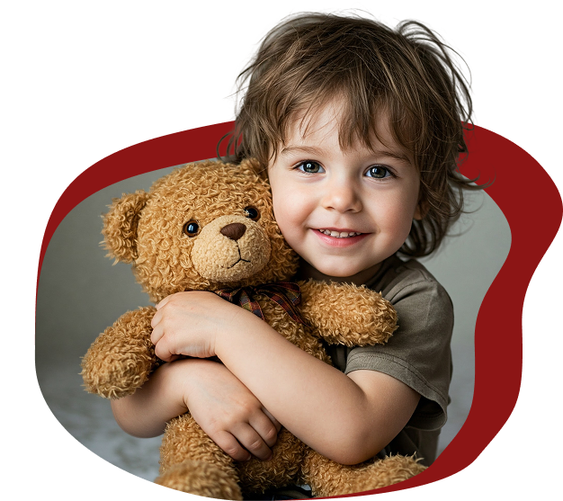 Boy holding stuffed bear